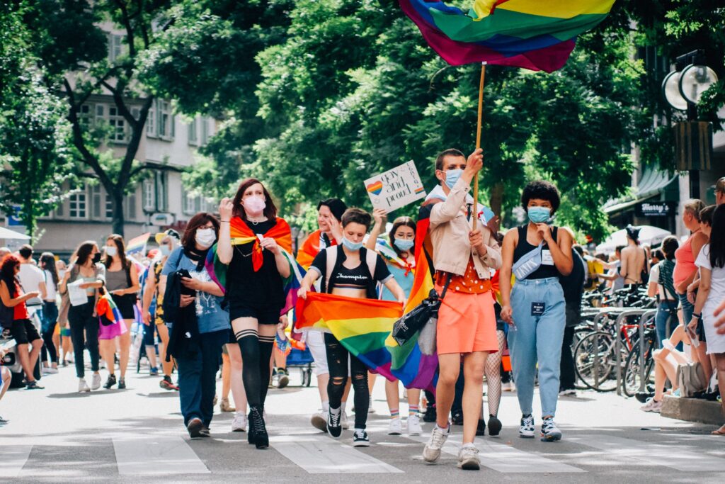 LGBTQ protestors marching down a street