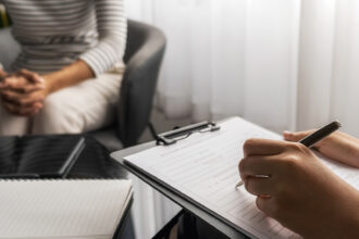 professional psychologist consulting on diagnostic examination disease in medical clinic or hospital